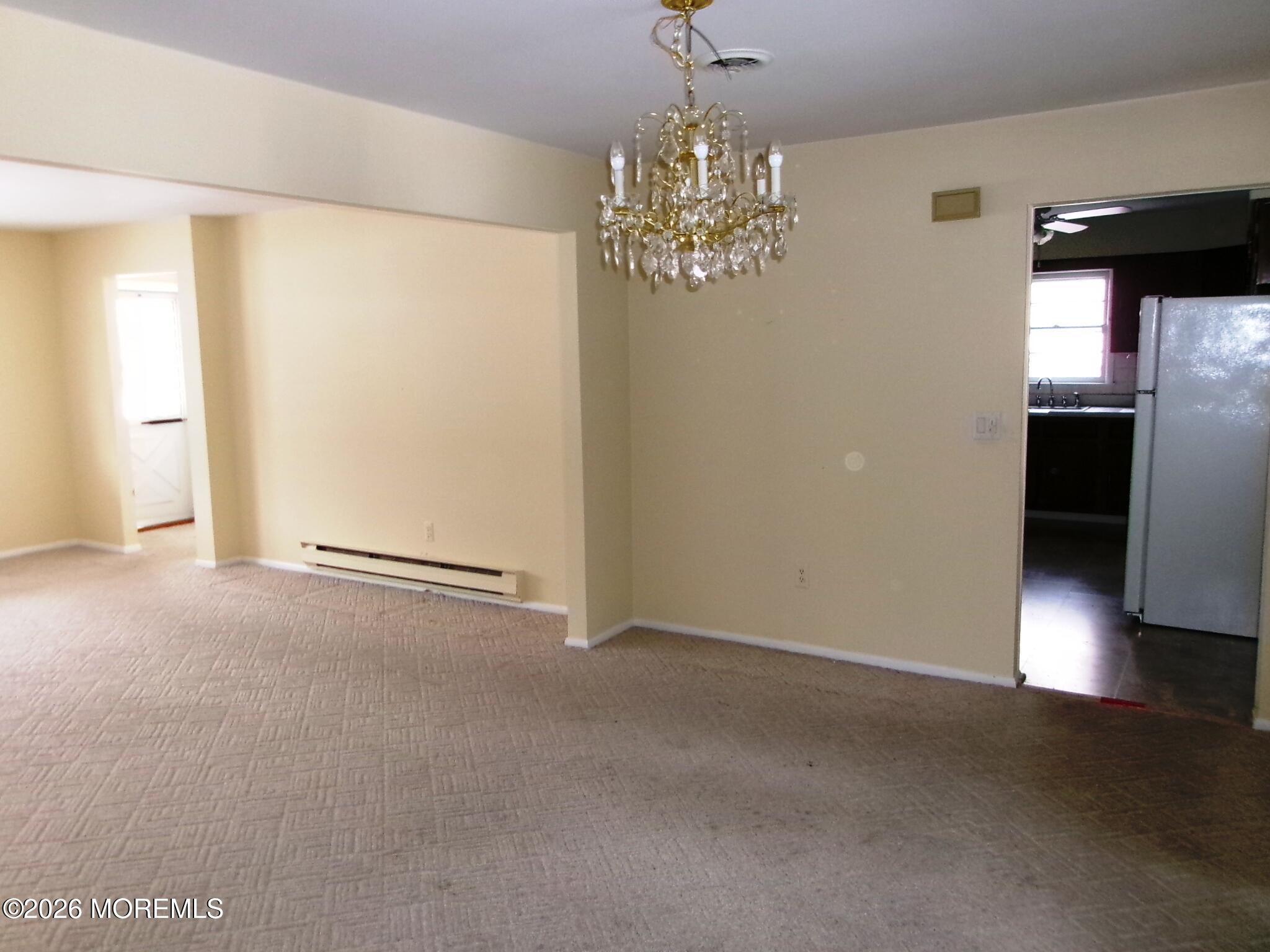 63 Eton Road Toms River, NJ 08757 - Photo 12 of 23 a view of a chandelier in big room and chandelier