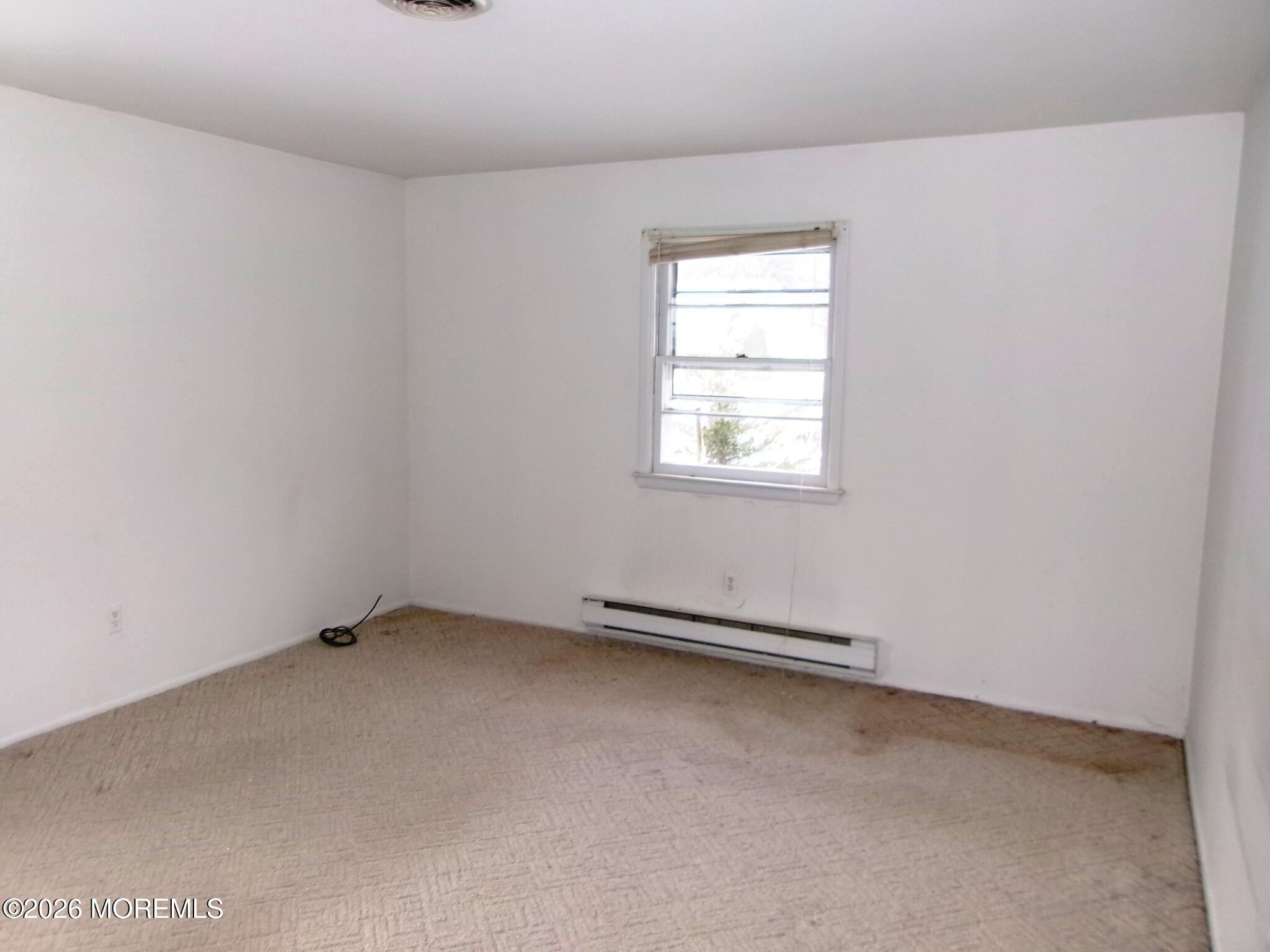 63 Eton Road Toms River, NJ 08757 - Photo 18 of 23 an empty room with a window