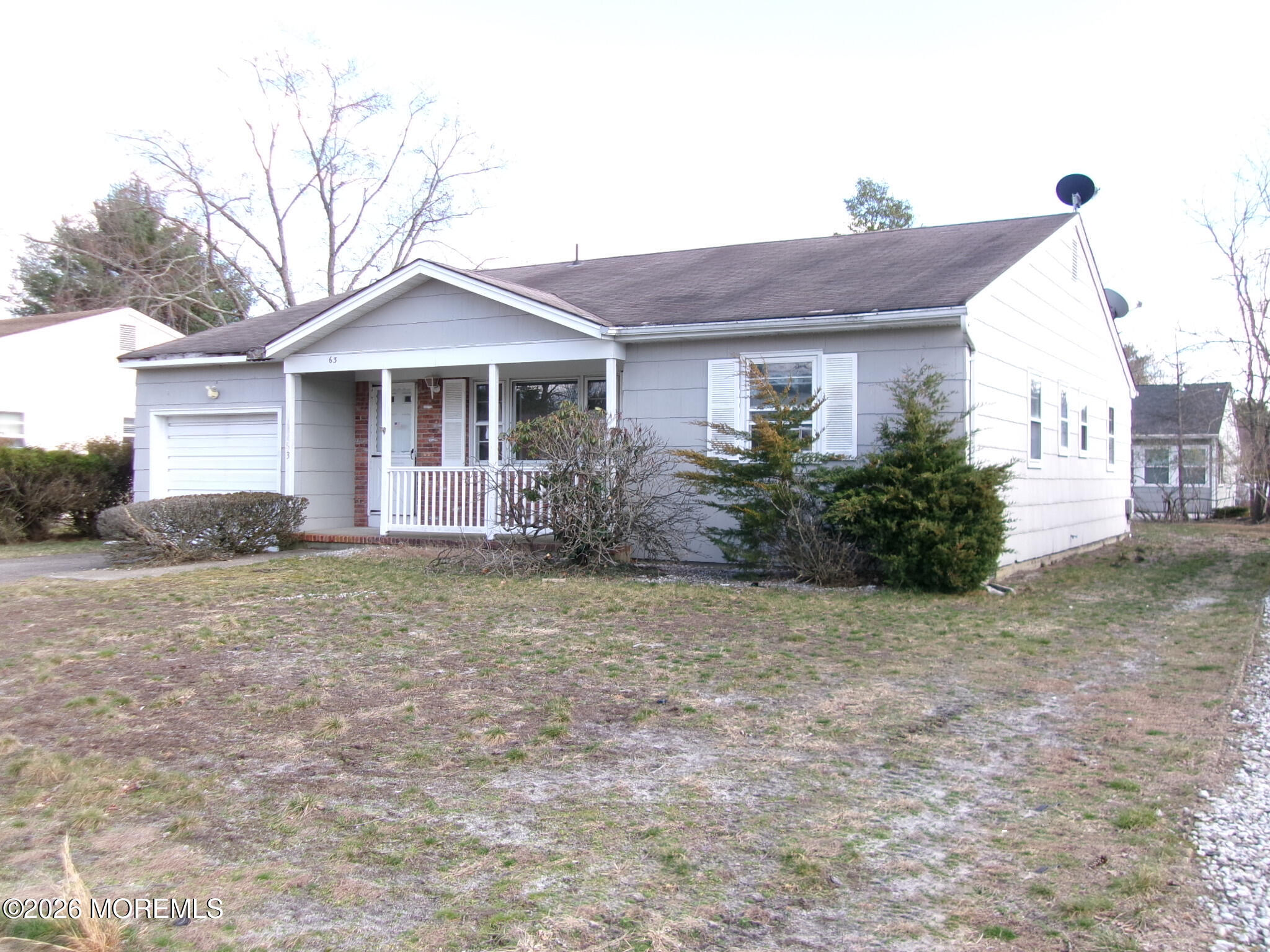 63 Eton Road Toms River, NJ 08757 - Photo 2 of 23 a front view of house with yard and trees around