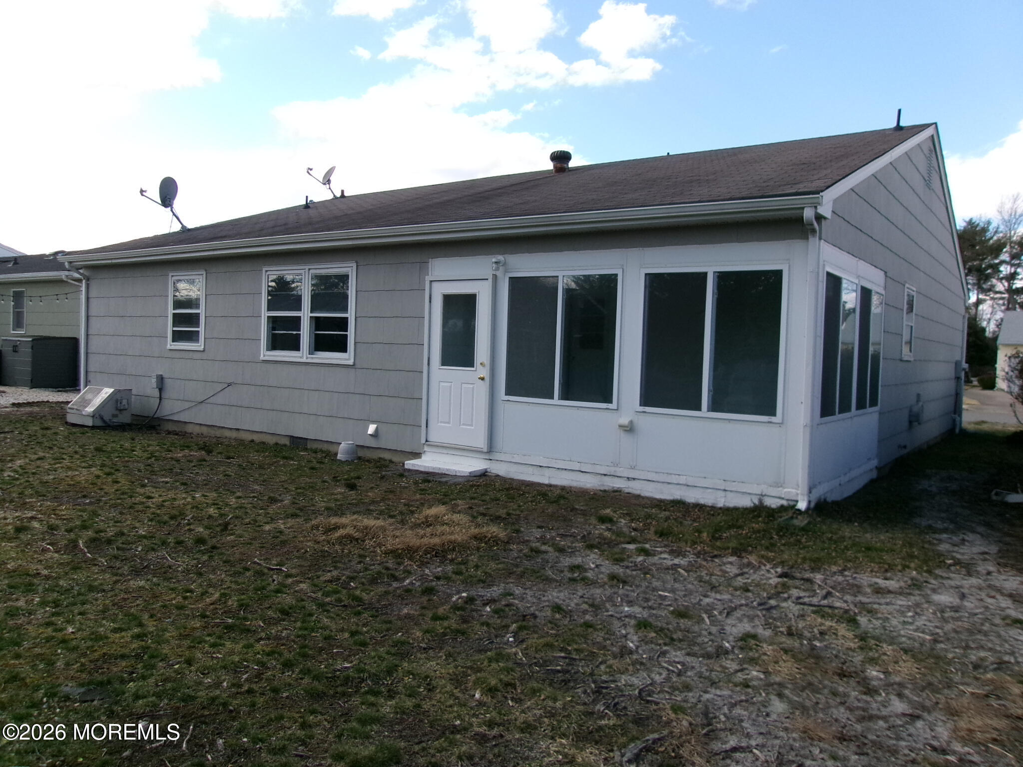 63 Eton Road Toms River, NJ 08757 - Photo 4 of 23 a house view with a backyard space