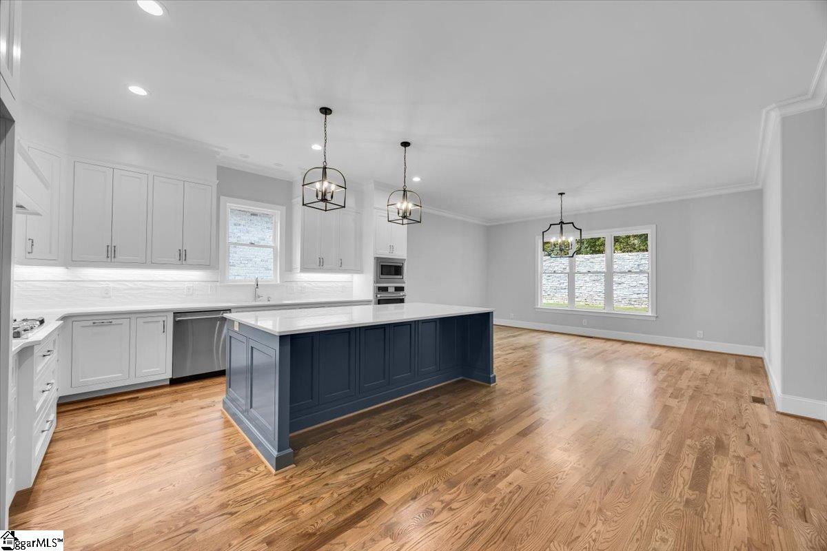 202 Chestnut Pond Lane Simpsonville, SC 29681 - Photo 16 of 50 Center Island with Quartz countertop offers smart storage in front and back and also offers seating for 4+.