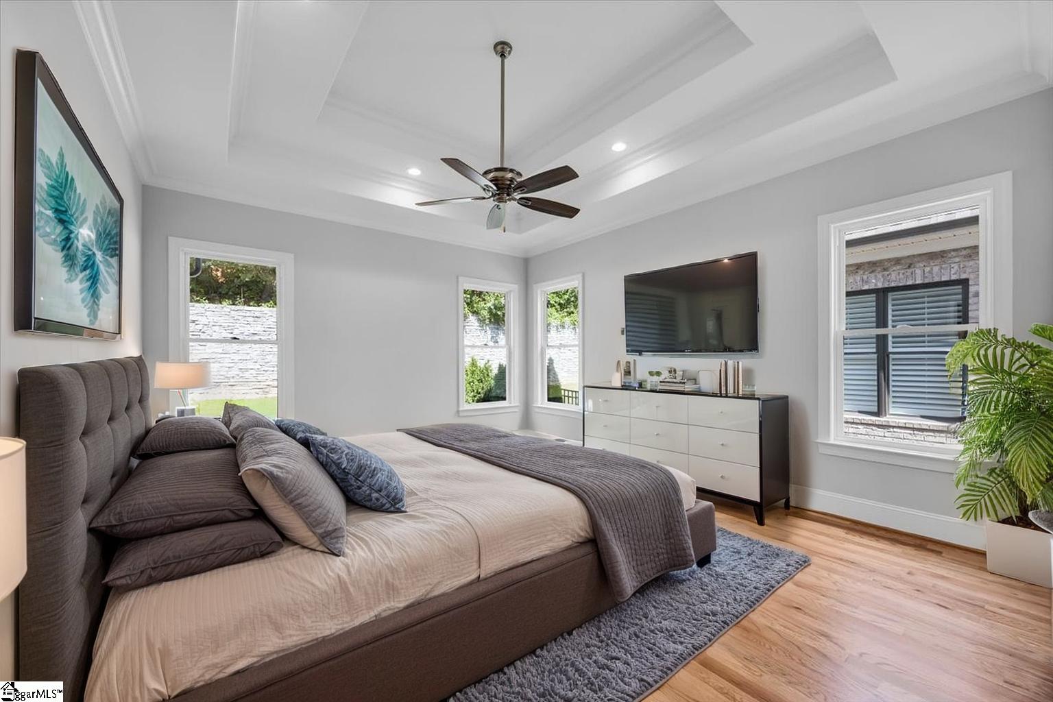 202 Chestnut Pond Lane Simpsonville, SC 29681 - Photo 27 of 50 On opposite side of home, walk into your double tray ceiling master/primary bedroom with recessed lighting and ceiling fan. Ensuite luxury bath.