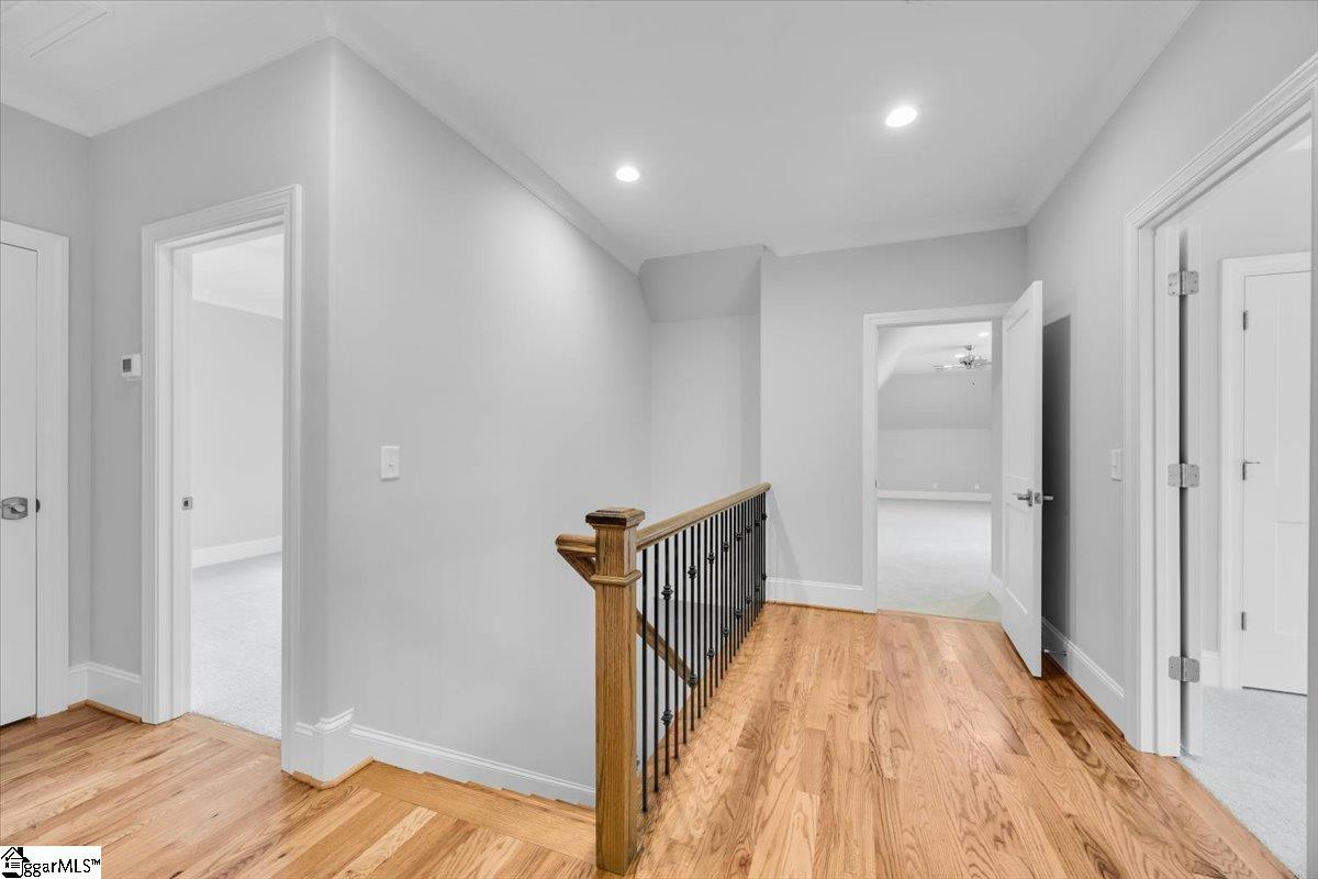 202 Chestnut Pond Lane Simpsonville, SC 29681 - Photo 34 of 50 Upstairs are all hardwoods. 2 bed rooms with custom closets. Bonus room and walk in storage.