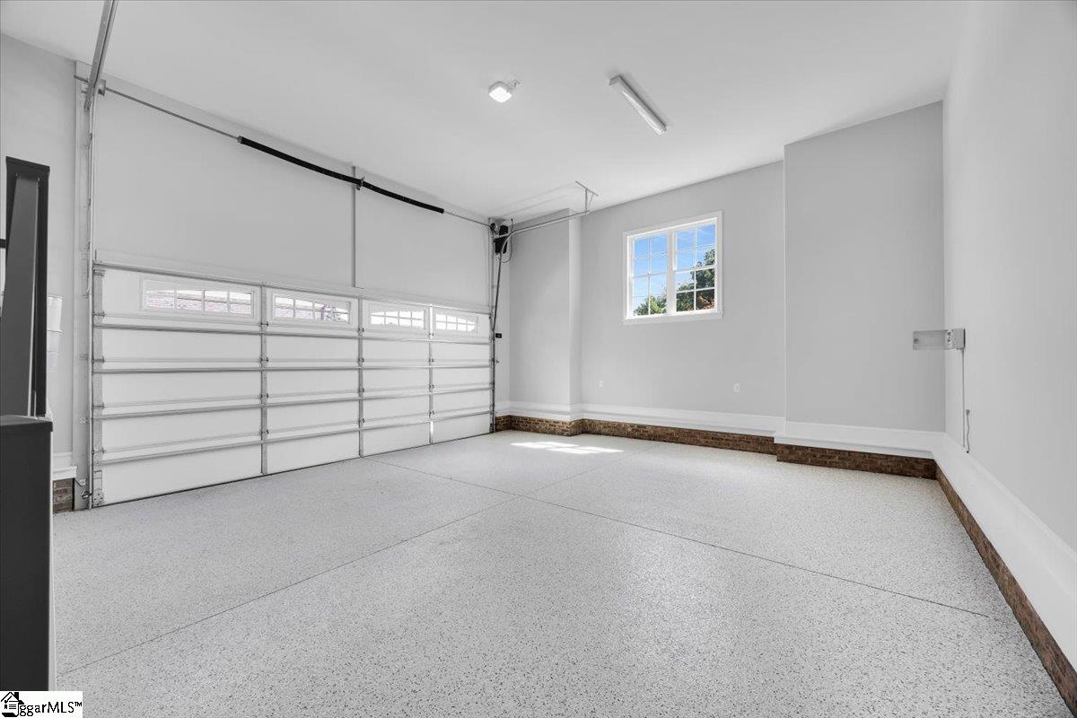 202 Chestnut Pond Lane Simpsonville, SC 29681 - Photo 46 of 50 2 Car attached garaged is Epoxy floored and offers enough space for a lift if needed.