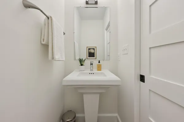 a large kitchen with stainless steel appliances granite countertop a stove and wooden floor