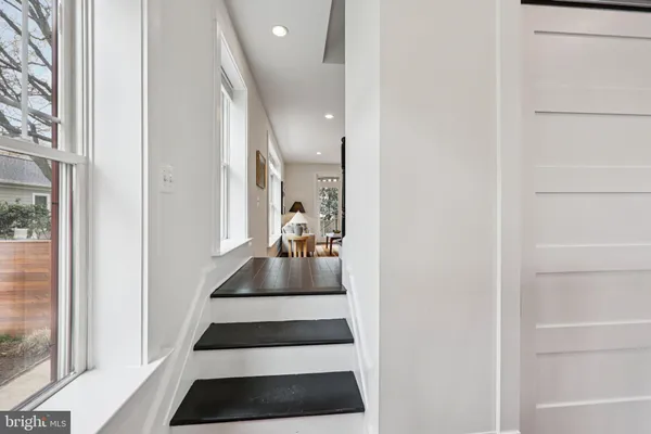 a kitchen with stainless steel appliances granite countertop wooden cabinets and a counter top space