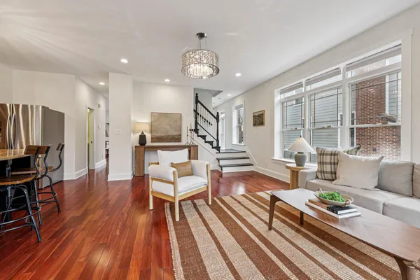 a kitchen with stainless steel appliances granite countertop sink stove top oven and cabinets