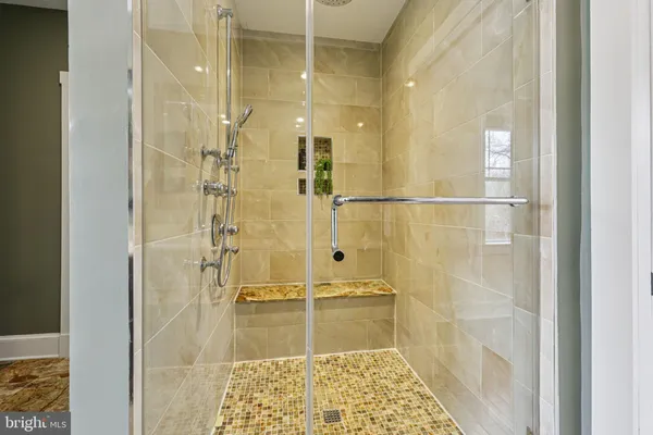 a kitchen with stainless steel appliances granite countertop a sink and a refrigerator