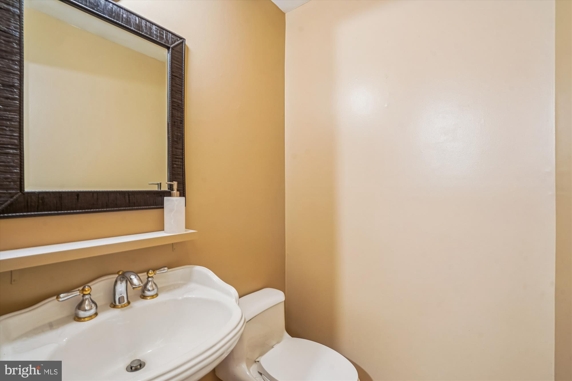 880 Azalea Drive, Unit 22880 Rockville, MD 20850 - Photo 11 of 39 a bathroom with a sink and a mirror