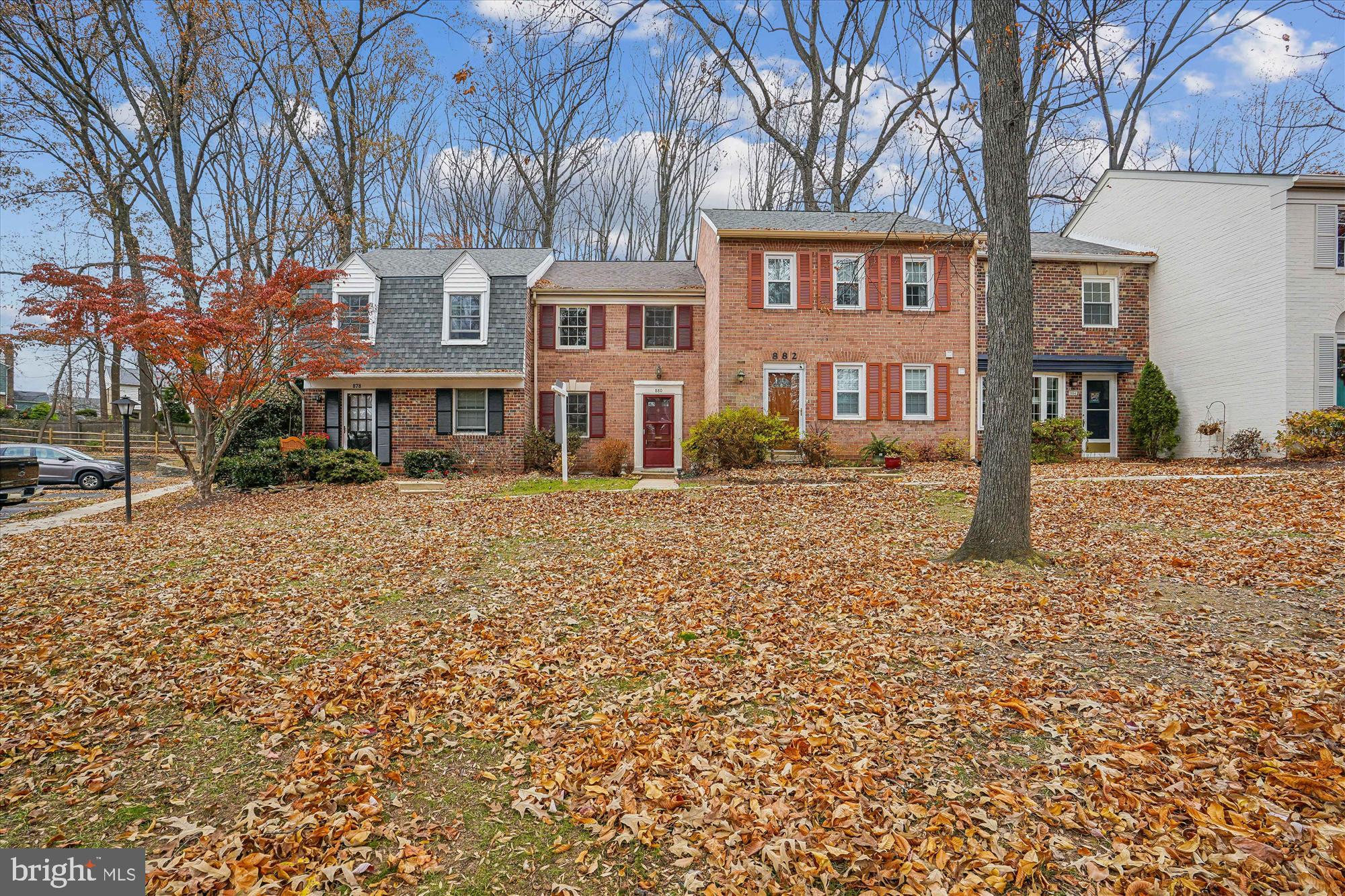 880 Azalea Drive, Unit 22880 Rockville, MD 20850 - Photo 2 of 39 a front view of a building with a yard