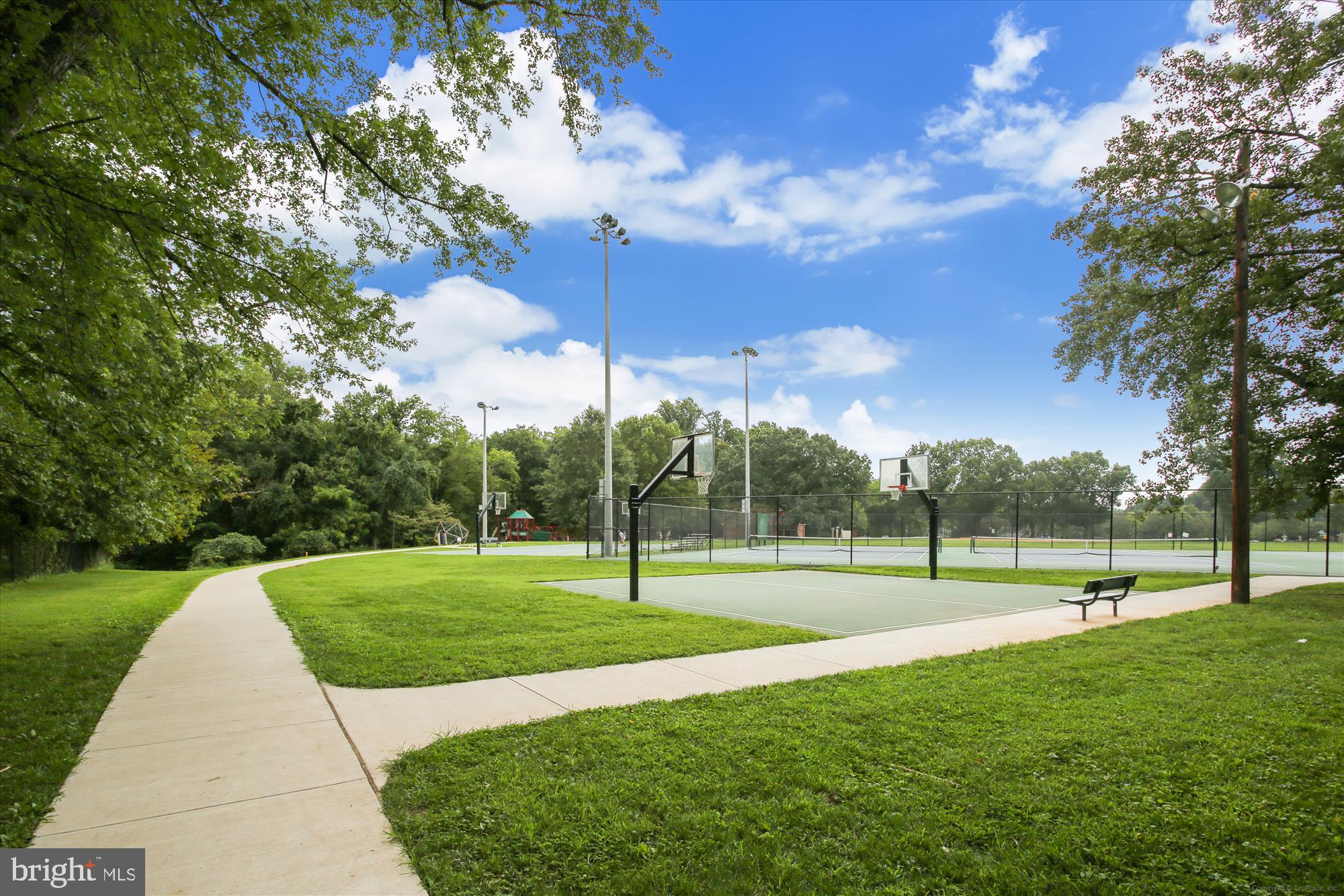 880 Azalea Drive, Unit 22880 Rockville, MD 20850 - Photo 25 of 39 a view of outdoor space with green field and trees