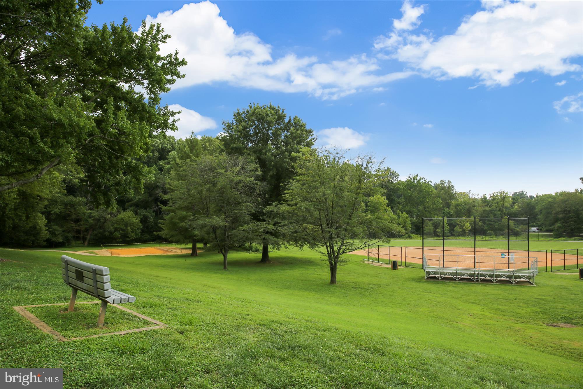 880 Azalea Drive, Unit 22880 Rockville, MD 20850 - Photo 30 of 39 a view of a park with a bench