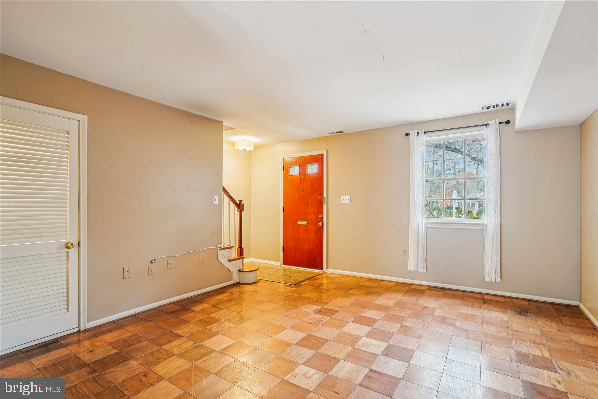 880 Azalea Drive, Unit 22880 Rockville, MD 20850 - Photo 4 of 39 a view of an empty room with window and cabinet