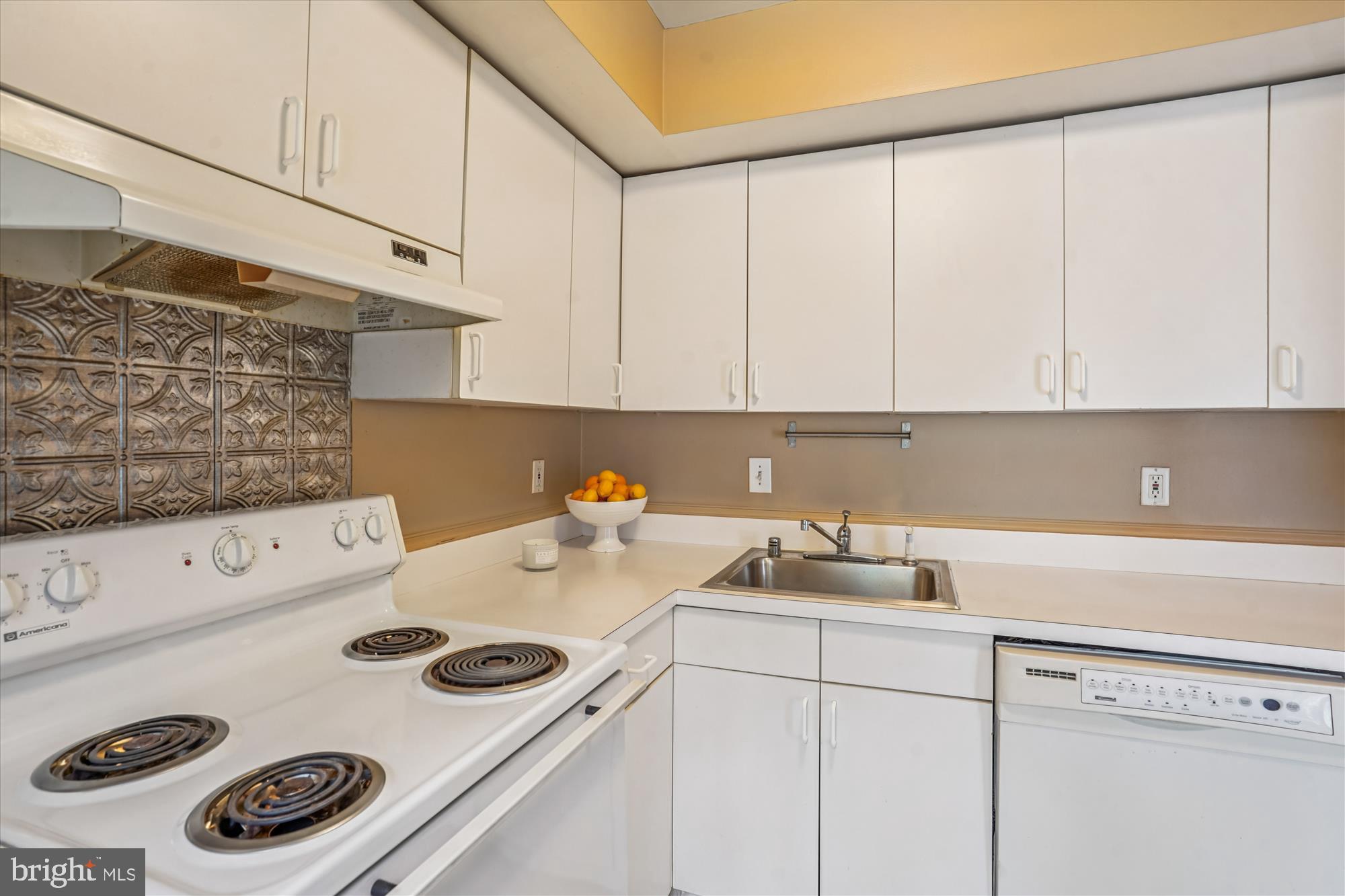 880 Azalea Drive, Unit 22880 Rockville, MD 20850 - Photo 9 of 39 a kitchen with a sink a stove and cabinets