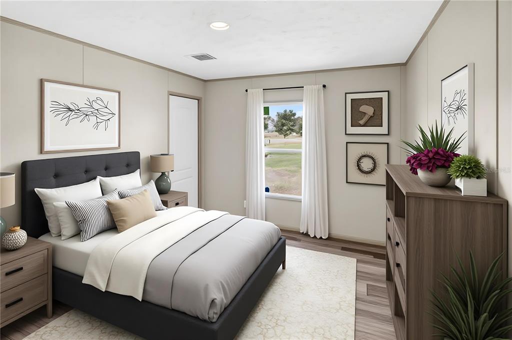 5570 Northeast 76th Avenue High Springs, FL 32643 - Photo 19 of 31 a bedroom with bed and a window