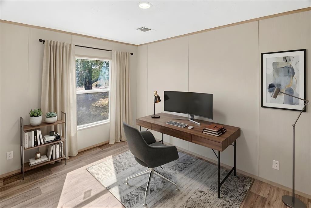 5570 Northeast 76th Avenue High Springs, FL 32643 - Photo 21 of 31 a view of a workspace with furniture and a window