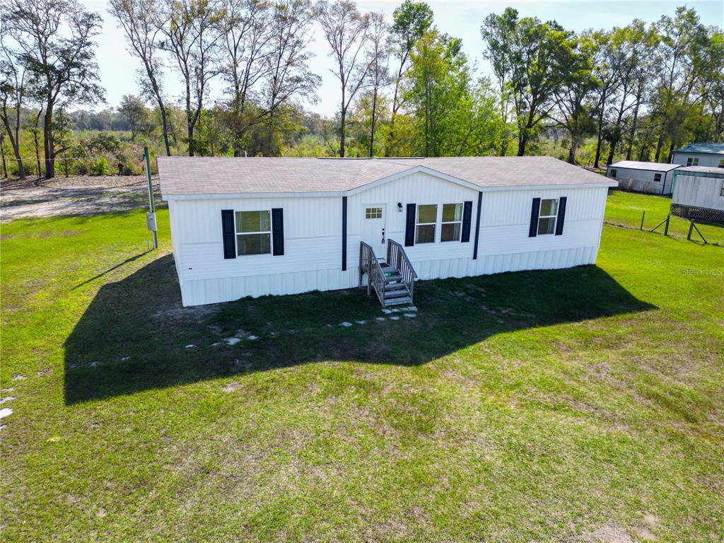 5570 Northeast 76th Avenue High Springs, FL 32643 - Photo 5 of 31 a view of a house with a yard
