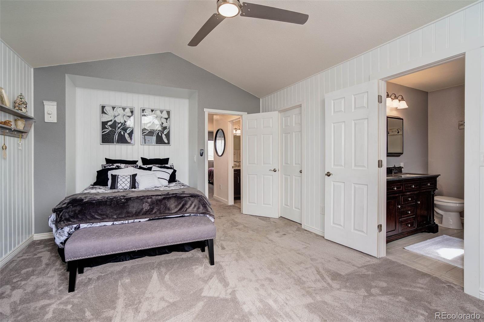 612 Ruby Drive Fort Collins, CO 80525 - Photo 16 of 40 a spacious bedroom with a bed and a cabinets