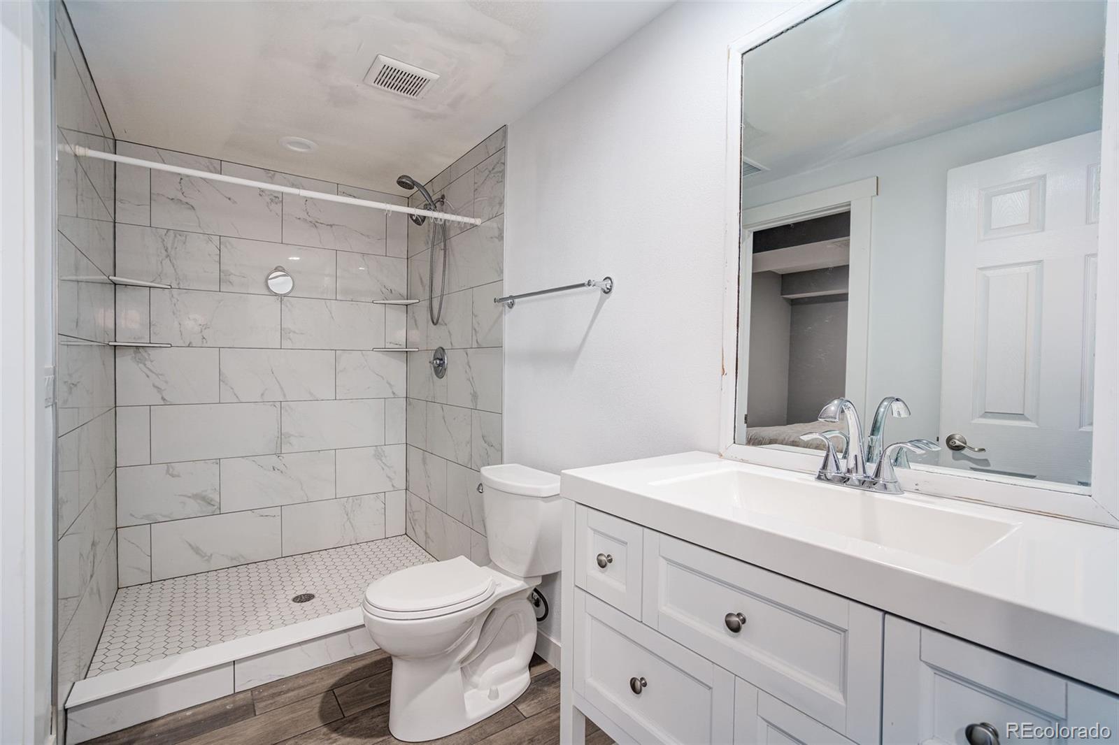 612 Ruby Drive Fort Collins, CO 80525 - Photo 26 of 40 a bathroom with a sink a toilet and shower
