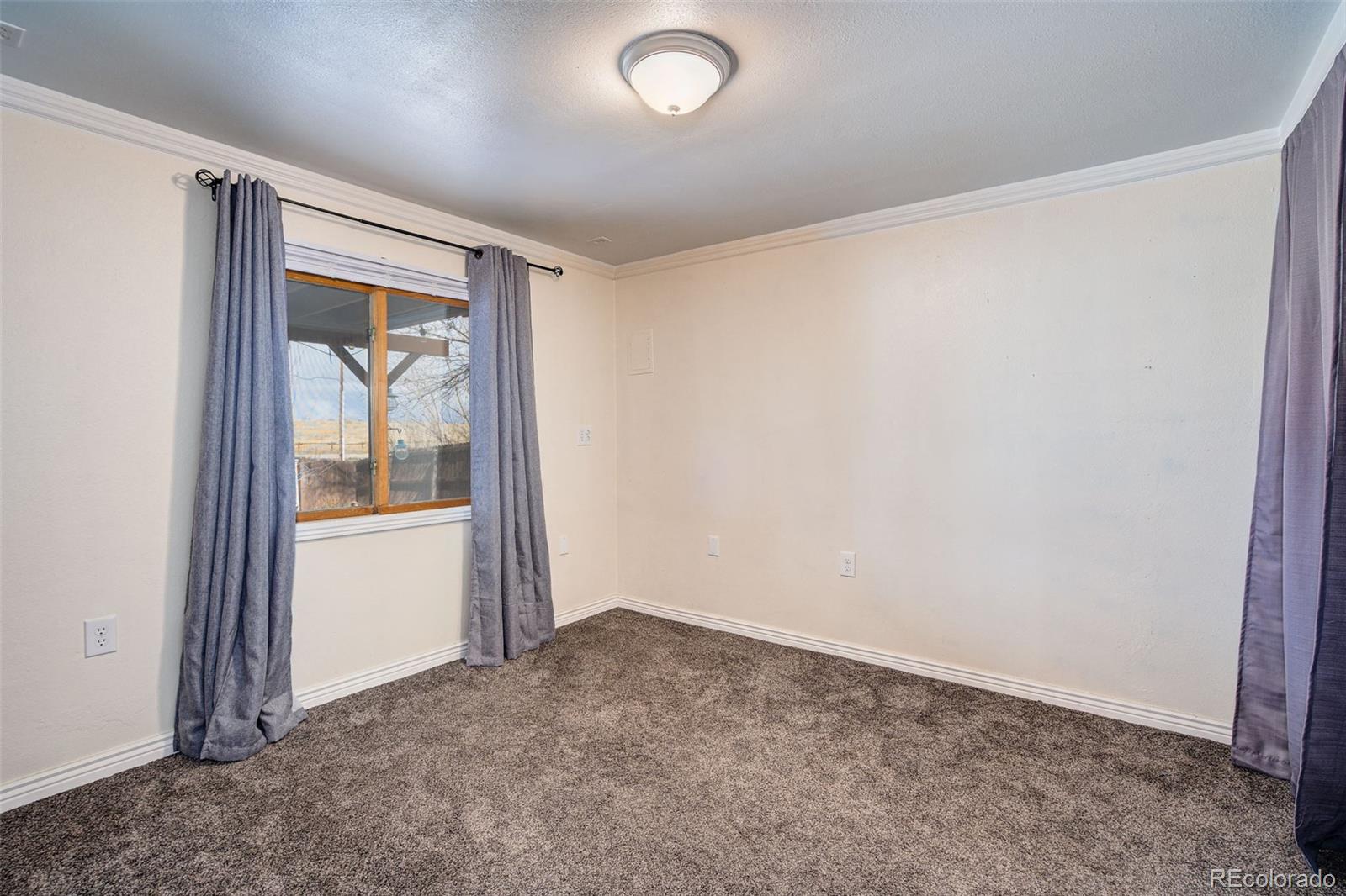612 Ruby Drive Fort Collins, CO 80525 - Photo 31 of 40 an empty room with a window