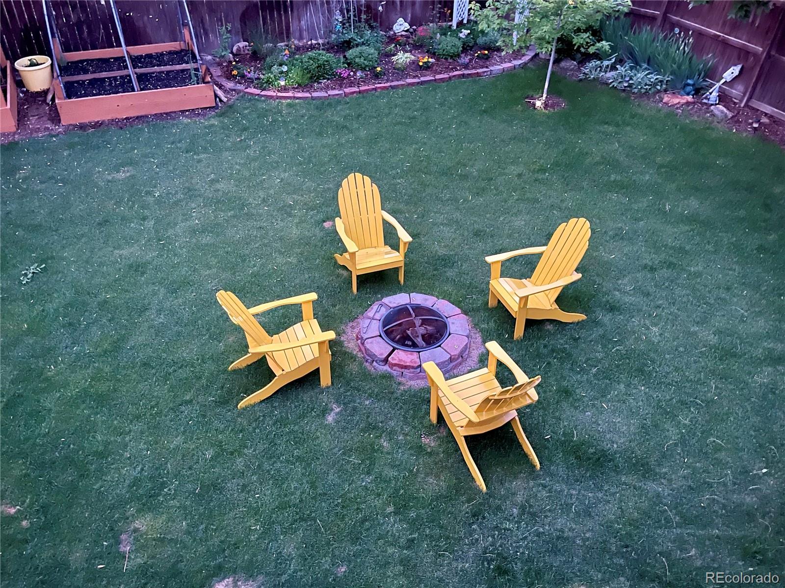 612 Ruby Drive Fort Collins, CO 80525 - Photo 39 of 40 swimming pool with outdoor seating and garden