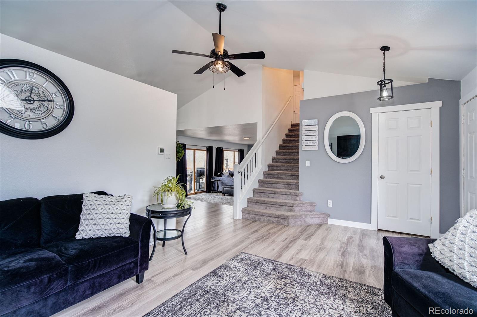 612 Ruby Drive Fort Collins, CO 80525 - Photo 5 of 40 a living room with furniture and a wooden floor