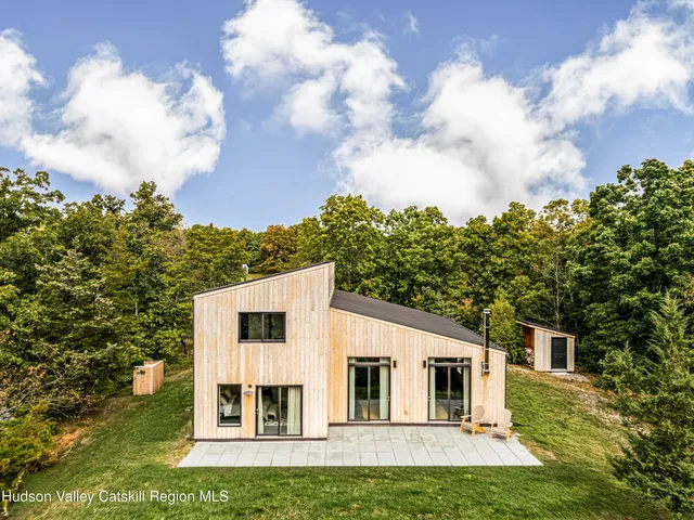 a view of house with yard and entertaining space