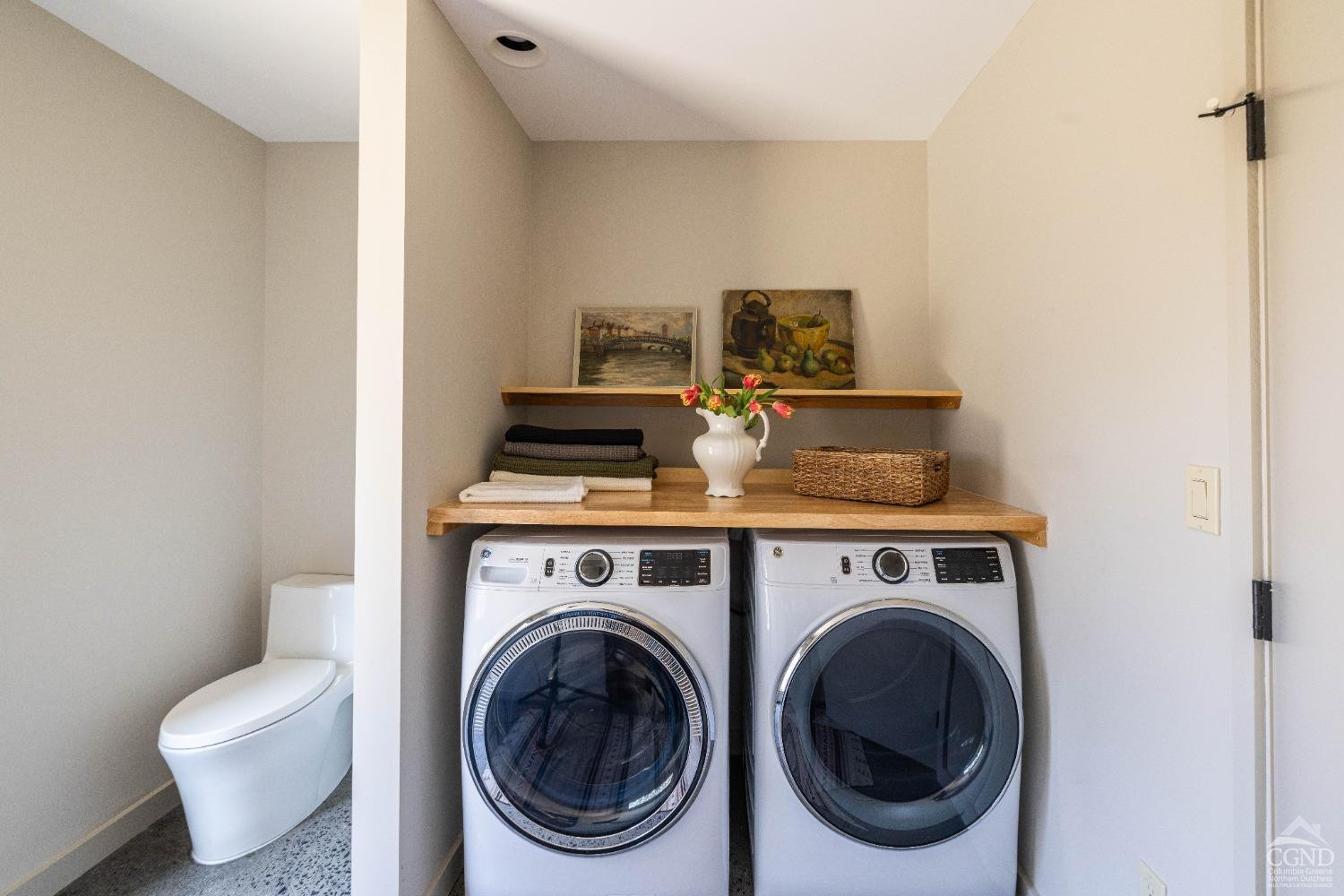 998 Willow Brook Road Milan, NY 12514 - Photo 20 of 34 a view of livingroom with washer and dryer