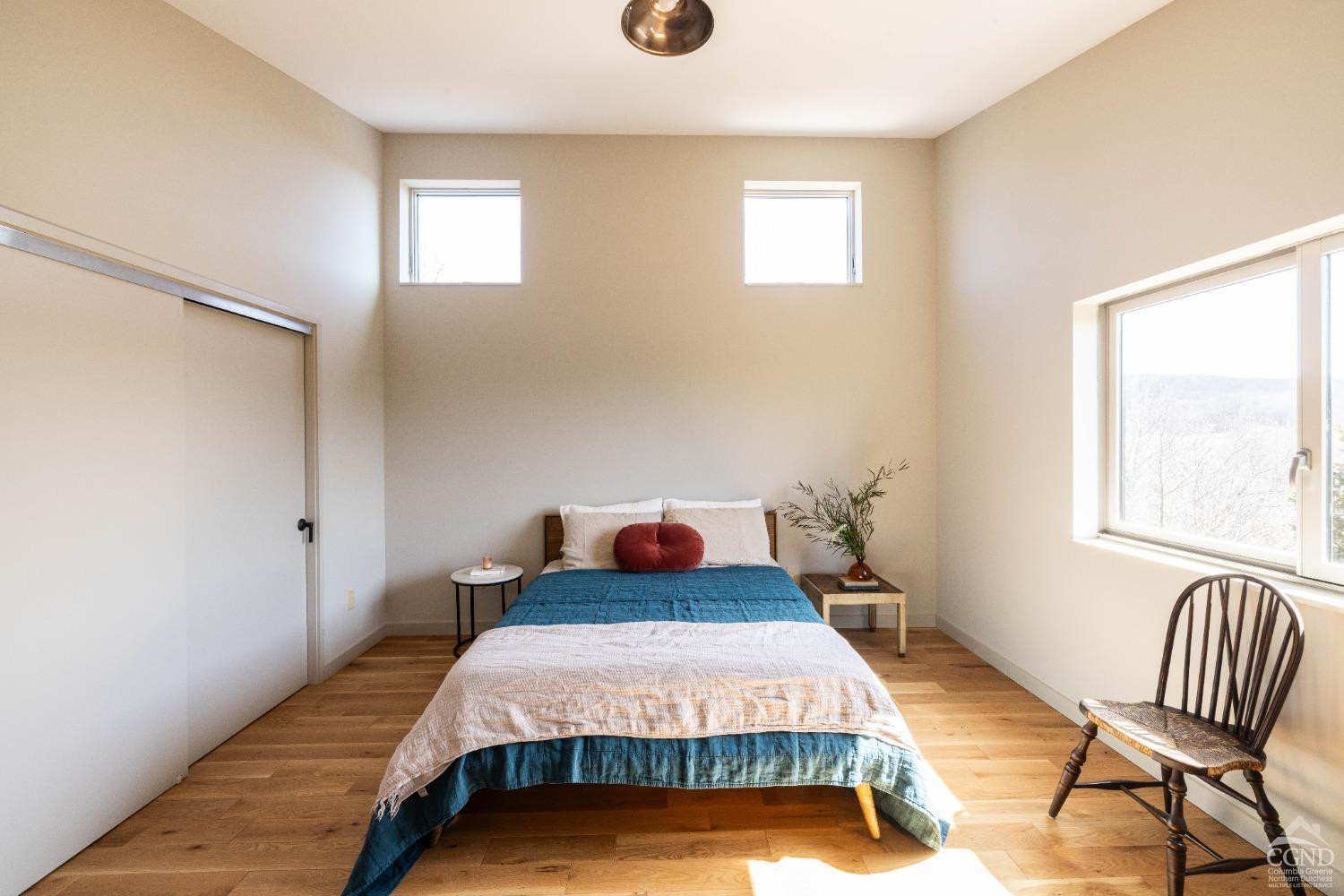 998 Willow Brook Road Milan, NY 12514 - Photo 26 of 34 a bedroom with a bed and windows