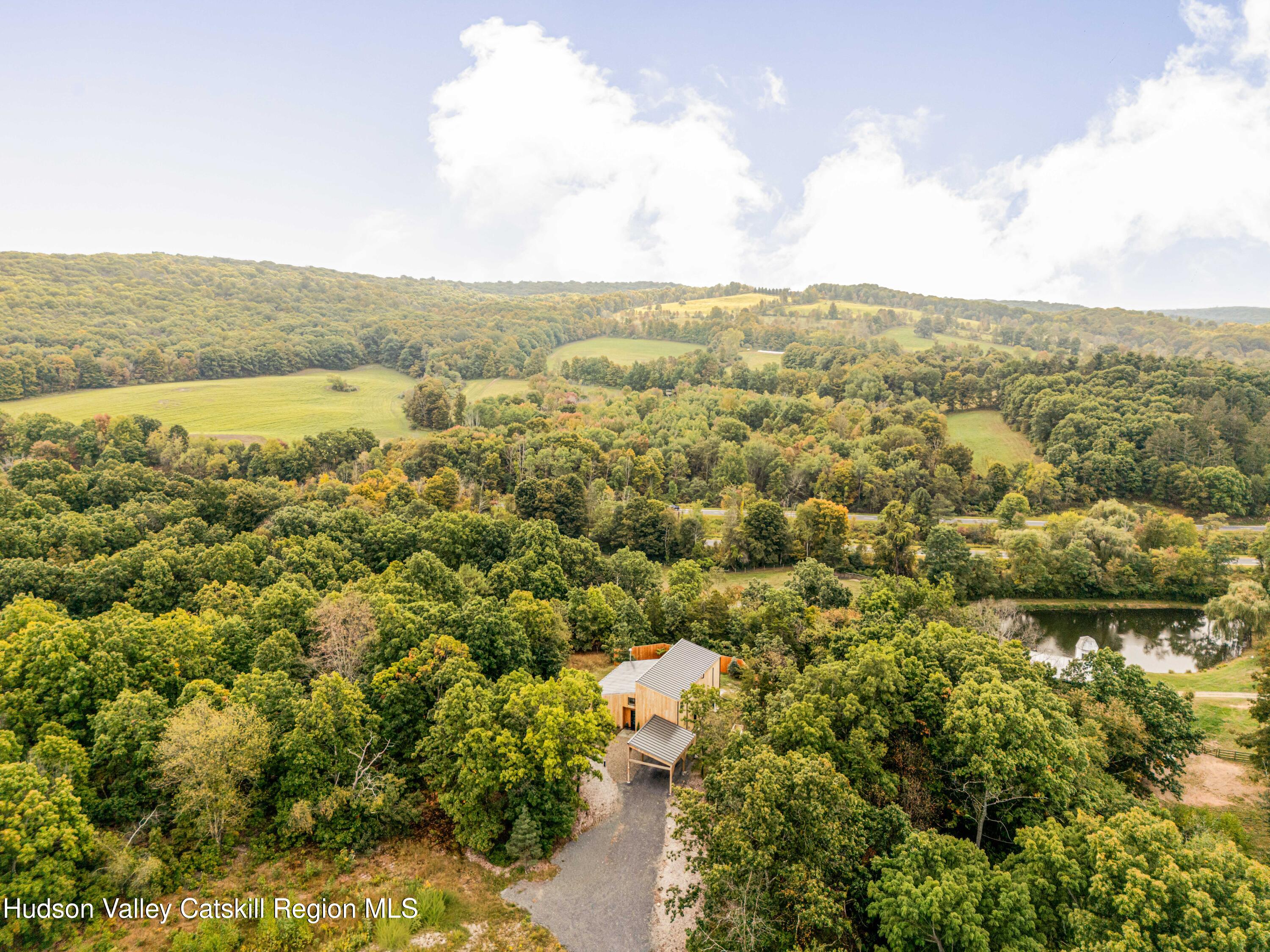 998 Willow Brook Road Milan, NY 12514 - Photo 29 of 34 an aerial view of residential houses with outdoor space and trees