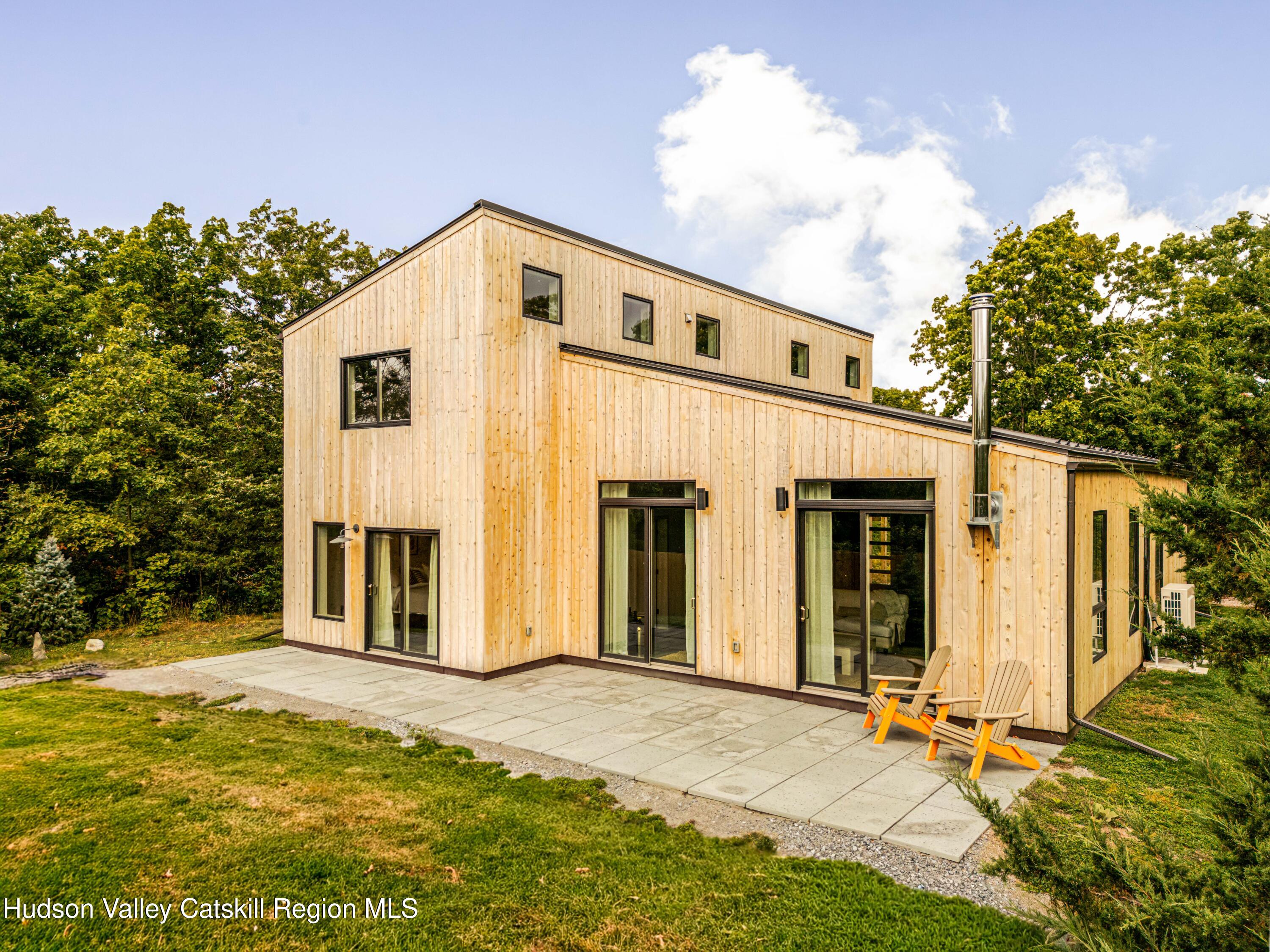 998 Willow Brook Road Milan, NY 12514 - Photo 4 of 34 a view of a house with backyard and sitting area