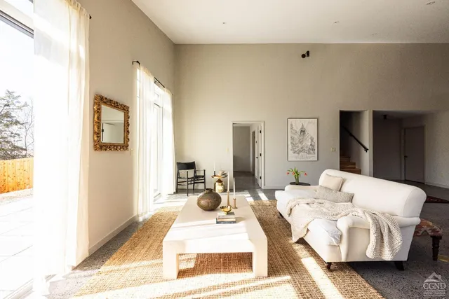 a bedroom with bed and a couch