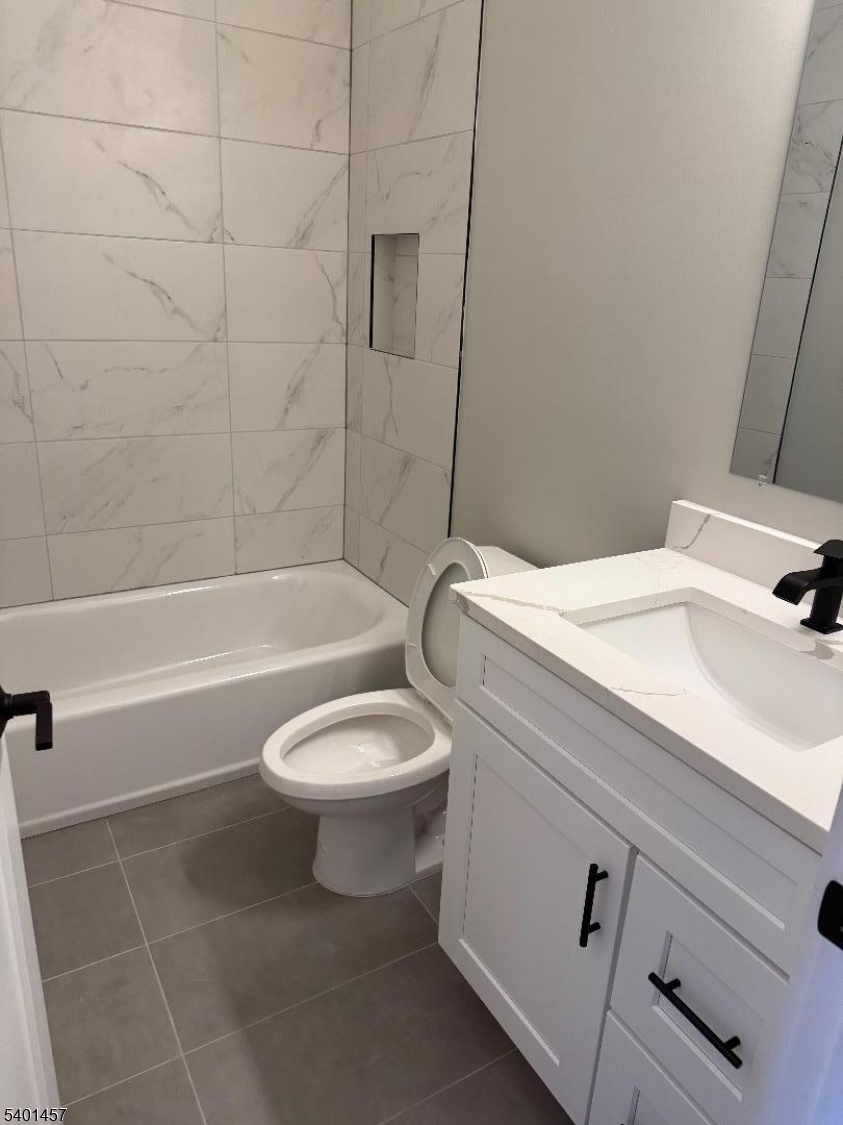 76 Barbara Street, Unit 1 Newark, NJ 07105 - Photo 8 of 8 a bathroom with a sink a toilet and a bathtub