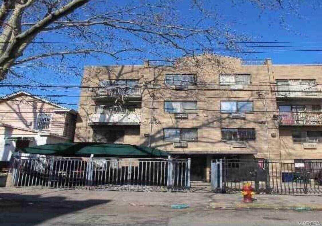 a view of a building with a street