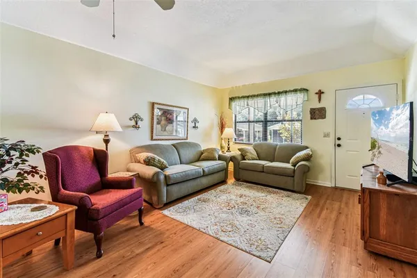a view of a livingroom with workspace and a couch