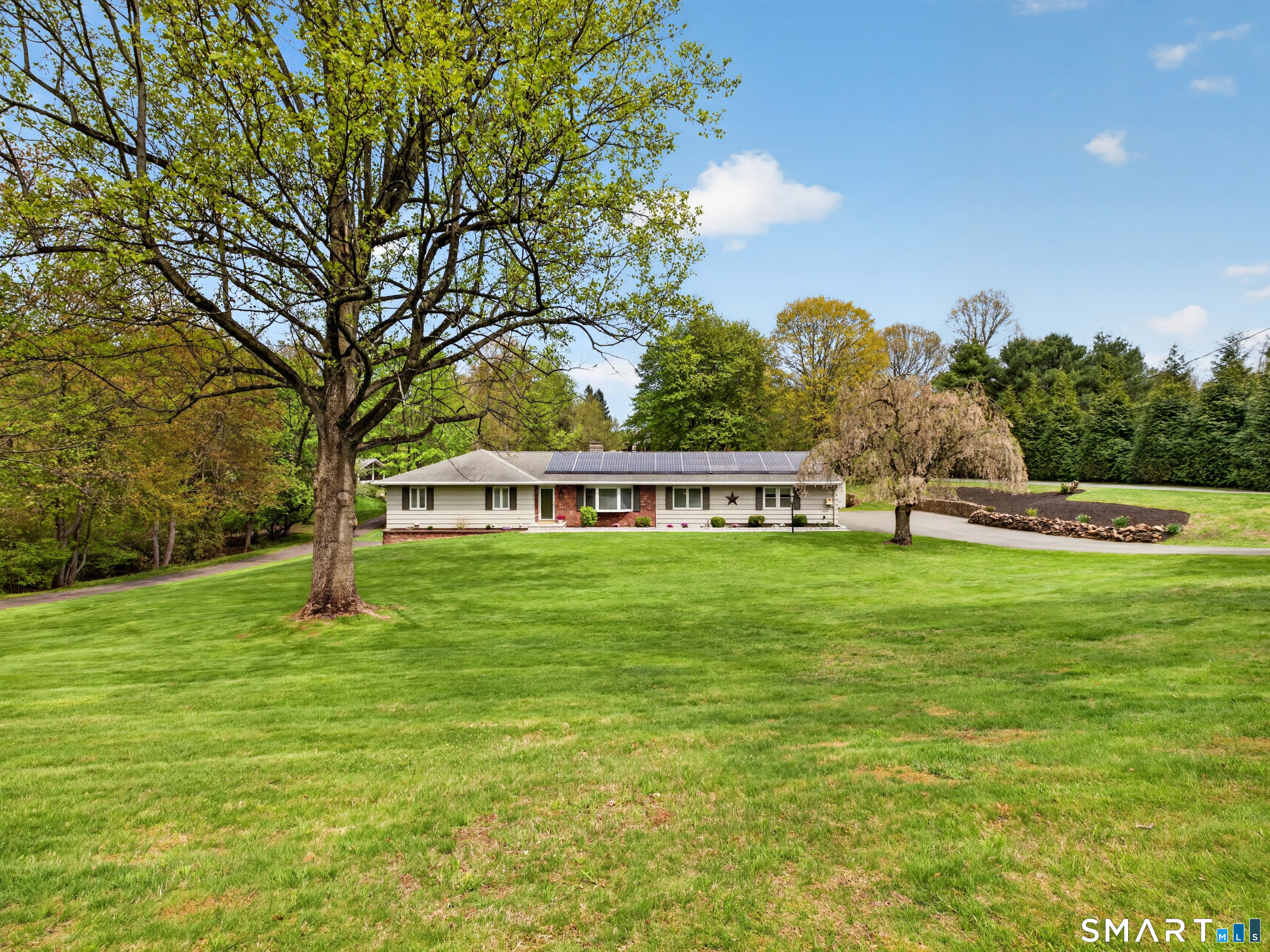 Welcome to this beautiful Ranch home set well back from Ridge Road.