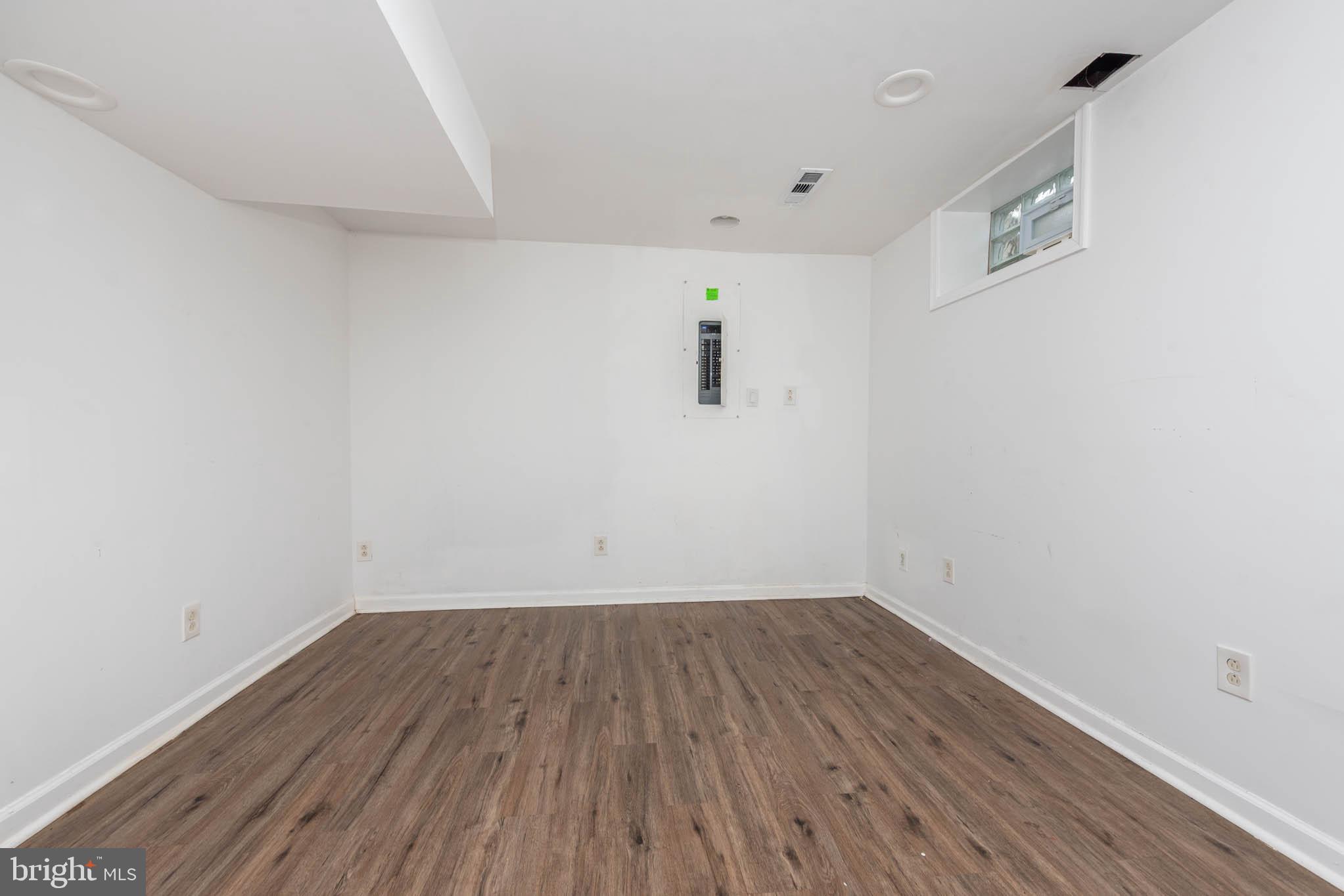 6702 Queens Ferry Road Baltimore, MD 21239 - Photo 29 of 40 a view of a room with wooden floor