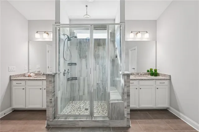 a bedroom with a large bed and a view of kitchen