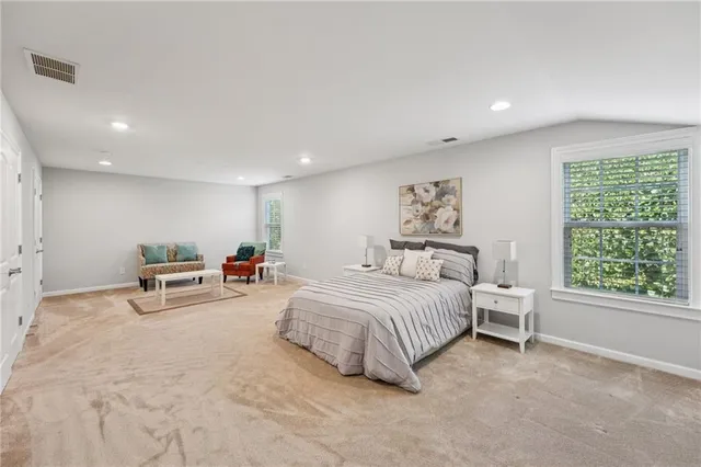 a front view of a house with a garden and a patio