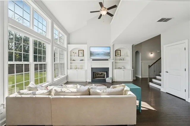 a living room with furniture and a large window