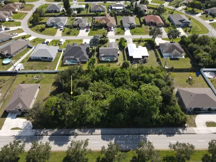 an aerial view of houses with yard