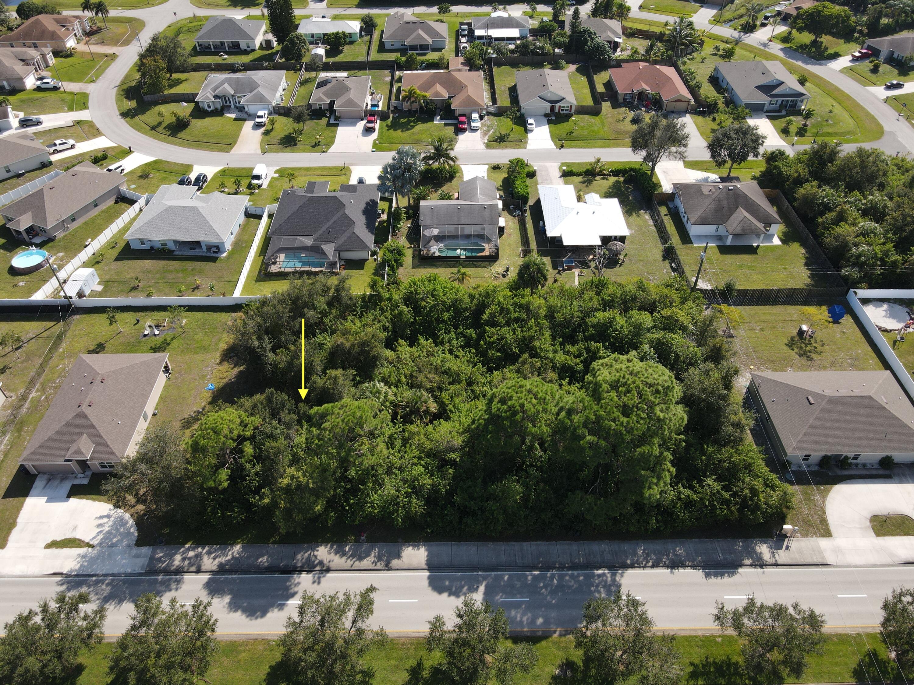 an aerial view of houses with yard