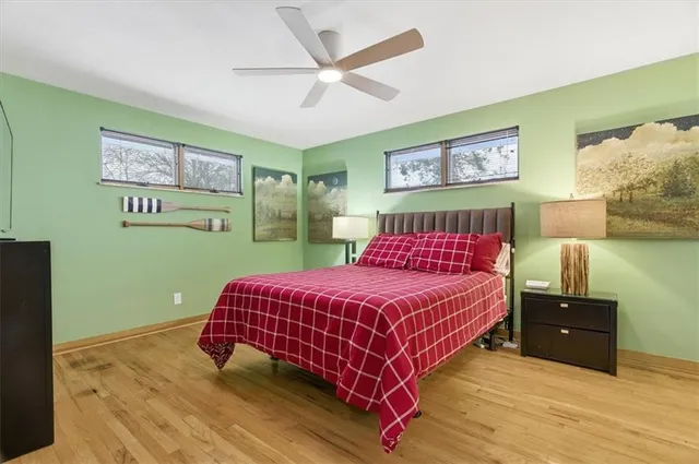 a bedroom with a bed and dresser