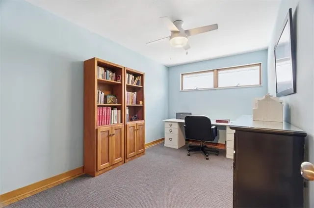 a workspace with furniture and window