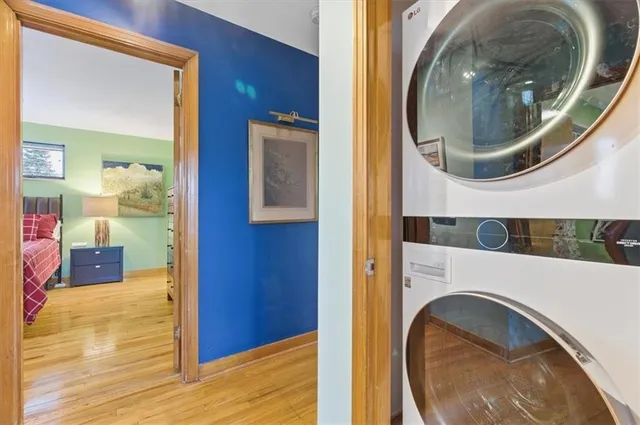 a view of a bedroom with washer and dryer