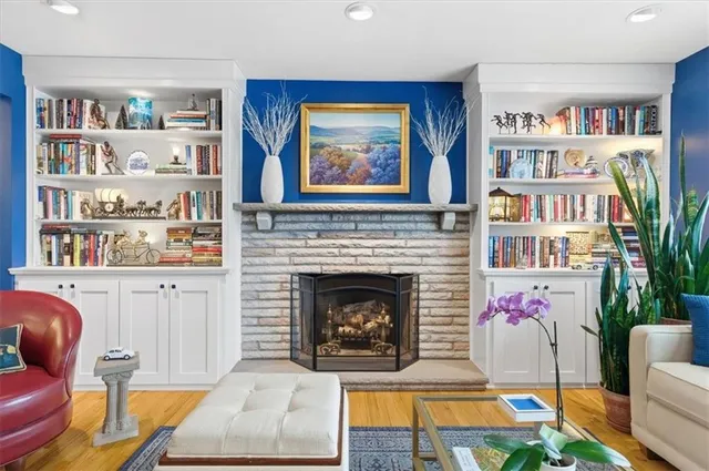 a living room with furniture and a fireplace