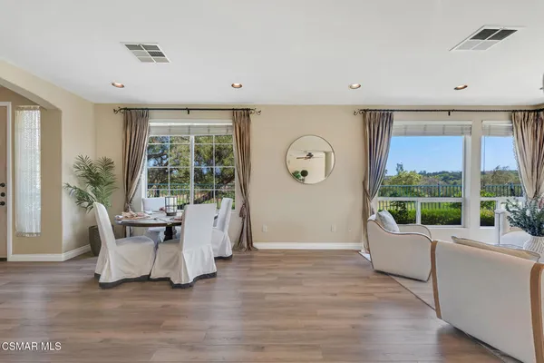 a view of an entryway with wooden floor