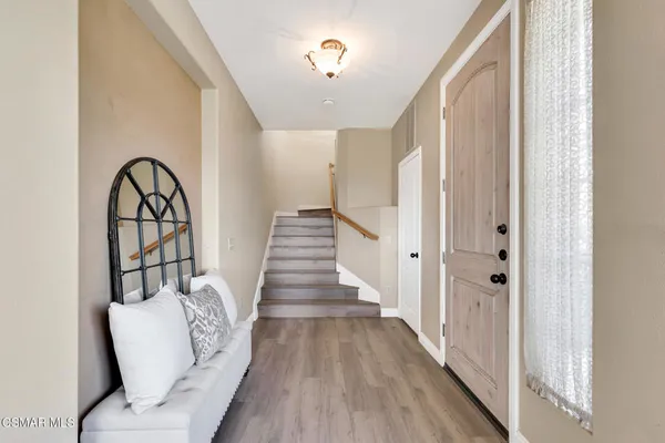 a view of closet area with wooden floor
