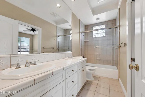 a view of a backyard with plants and a patio