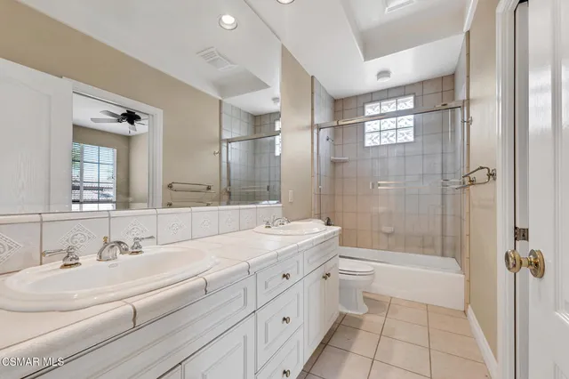 a view of a backyard with plants and a patio